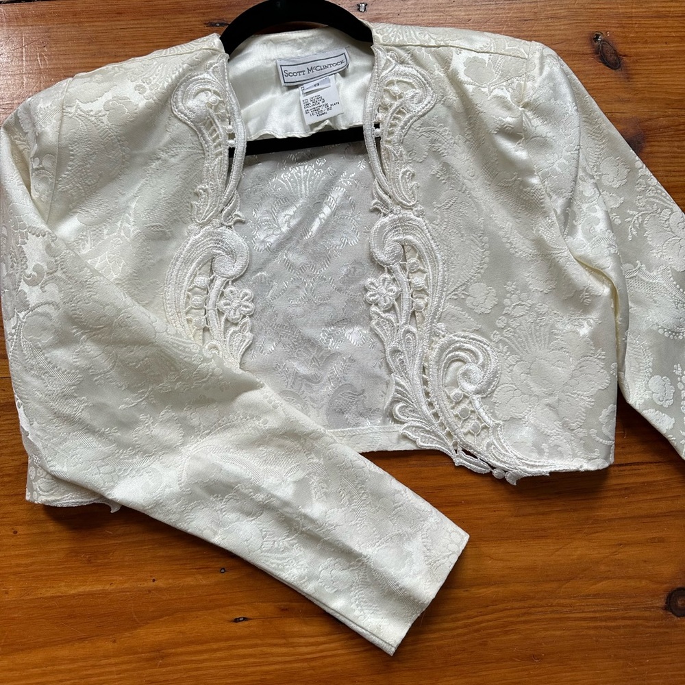 Scott Mcclintock white lace over coat.